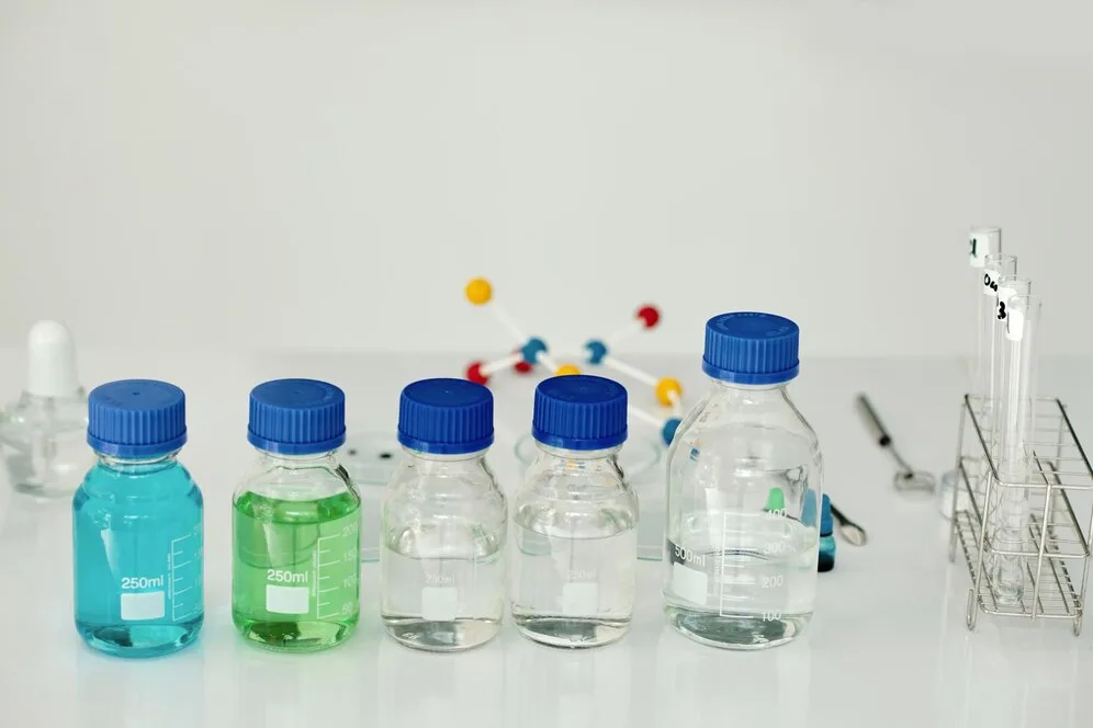 Assorted laboratory bottles and containers including HDPE, LDPE, PETG, glass, and plastic types